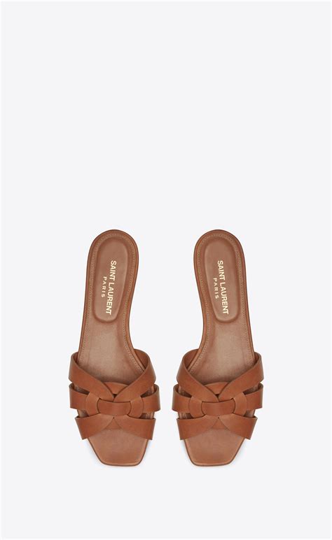 st laurent tribute flat sandals.